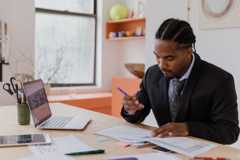 small business owner reviewing financial records after employee theft incident