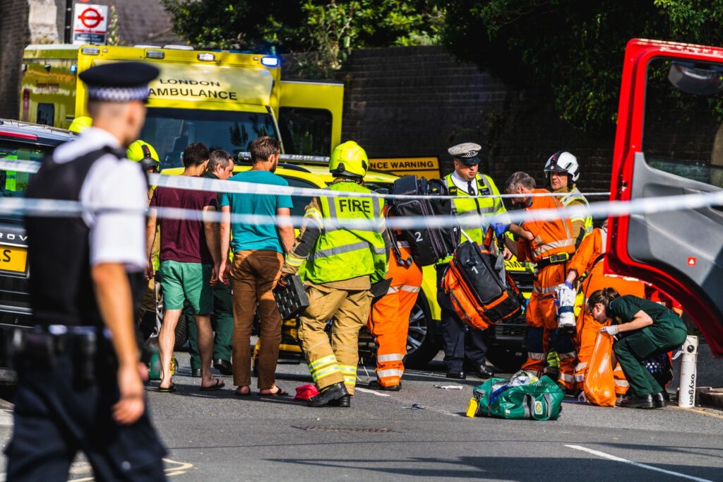 community members rushing to help injured person at fatal Independence hit and run scene