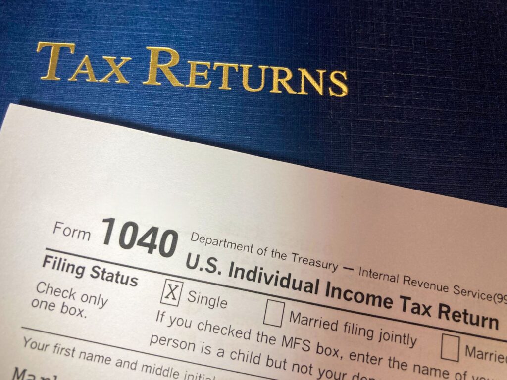 person completing state homeowner rebate application for $1,400 stimulus payment