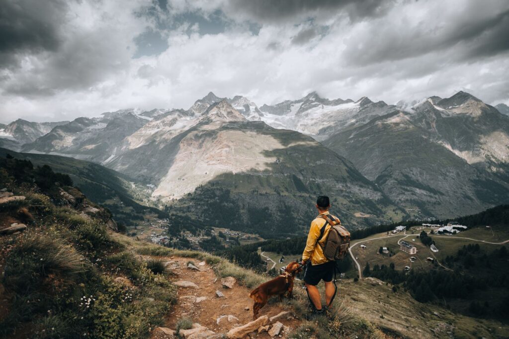 owner hiking with dog at a scenic dog-friendly park in the western United States