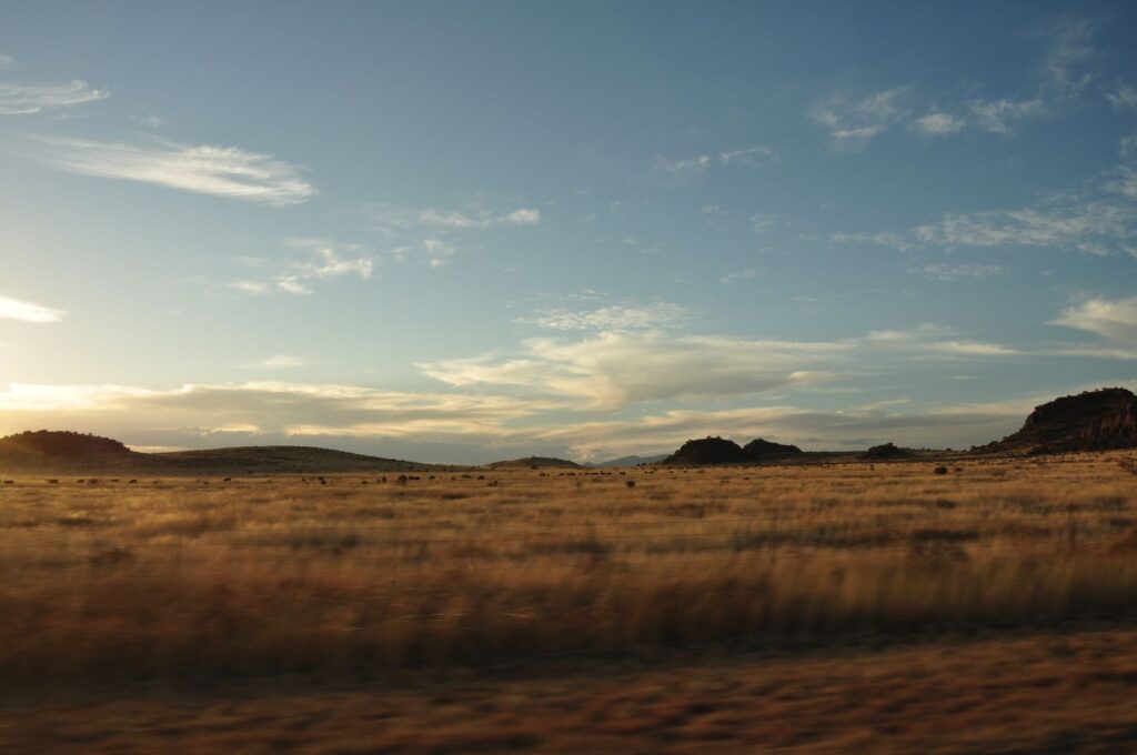 empty West Texas highway representing geographic isolation and mental health access challenges