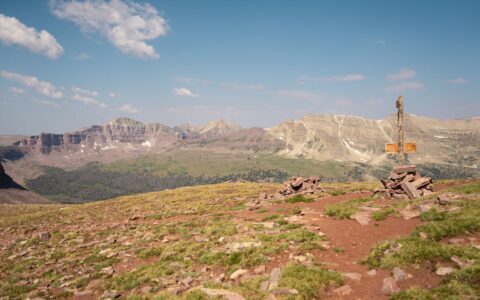 hiker standing at Kings Peak, Utah's highest point
