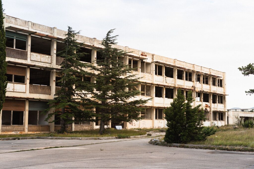 abandoned state psychiatric hospital building in Kansas during sunset