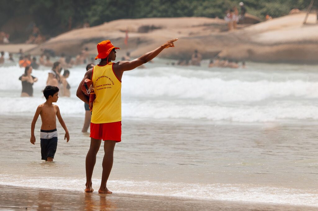 swimmer in California ocean following safety guidelines near shark warning zone