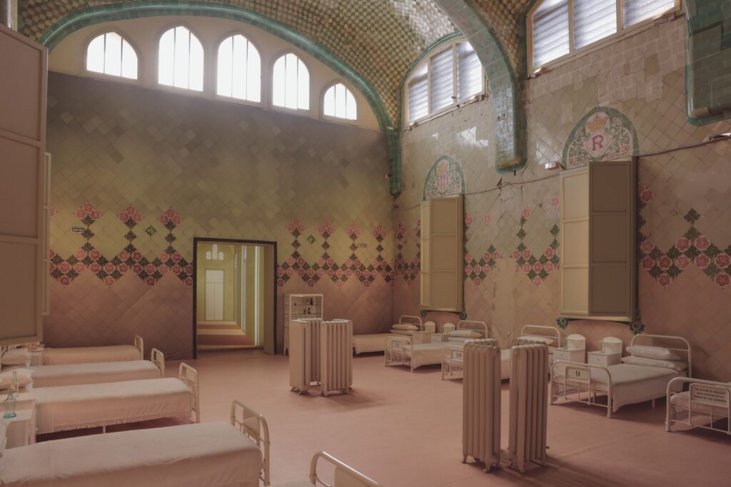 interior of an overcrowded state hospital ward in early American history