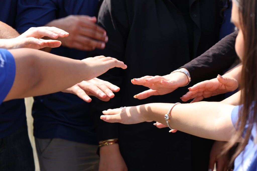 a diverse group of Georgia residents participating in a community mental health support meeting