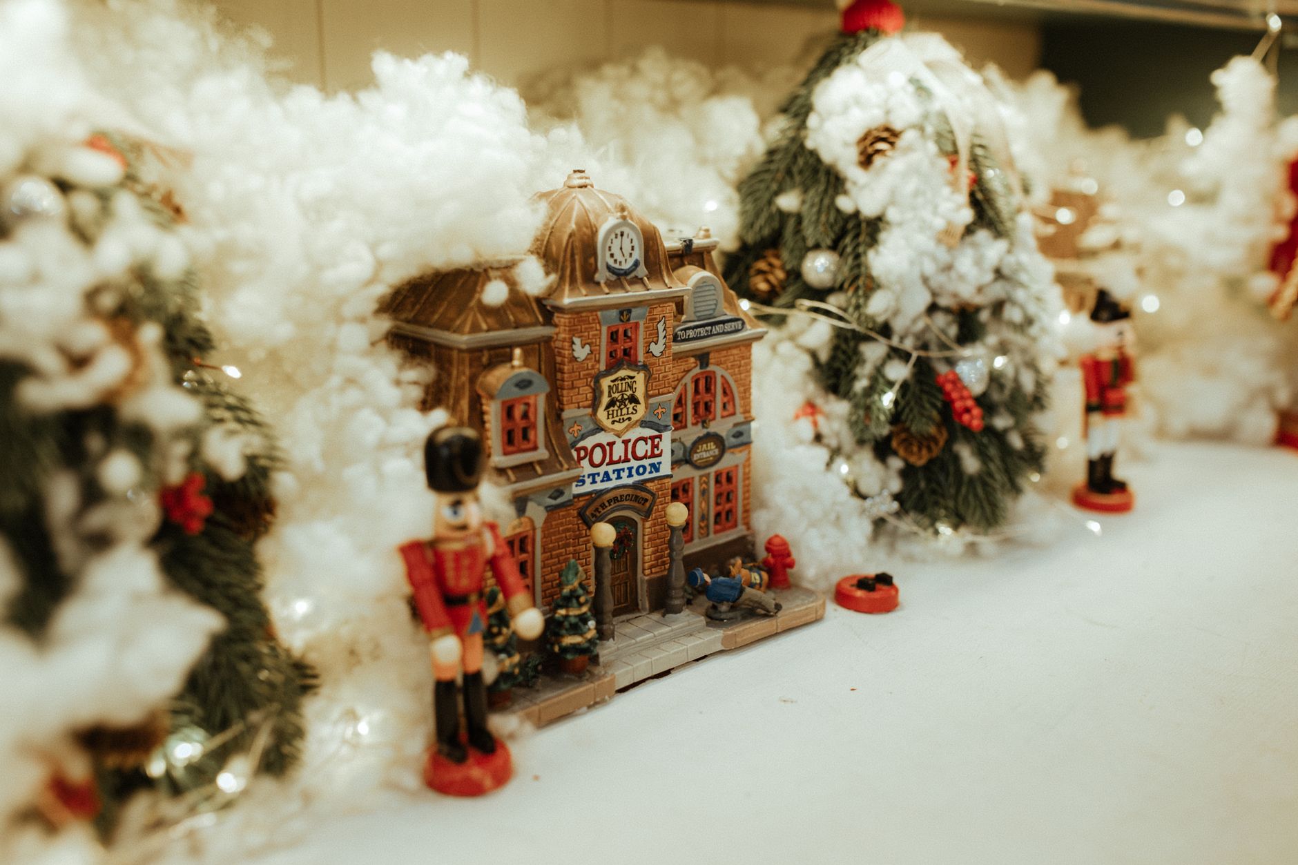 citizens gathered around a festive Christmas tree village display