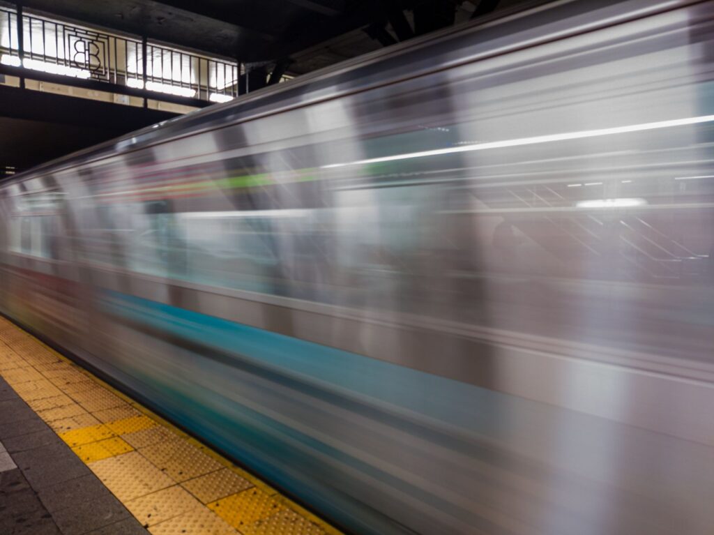 NYPD officer patrolling NYC subway platform after assault and robbery incident