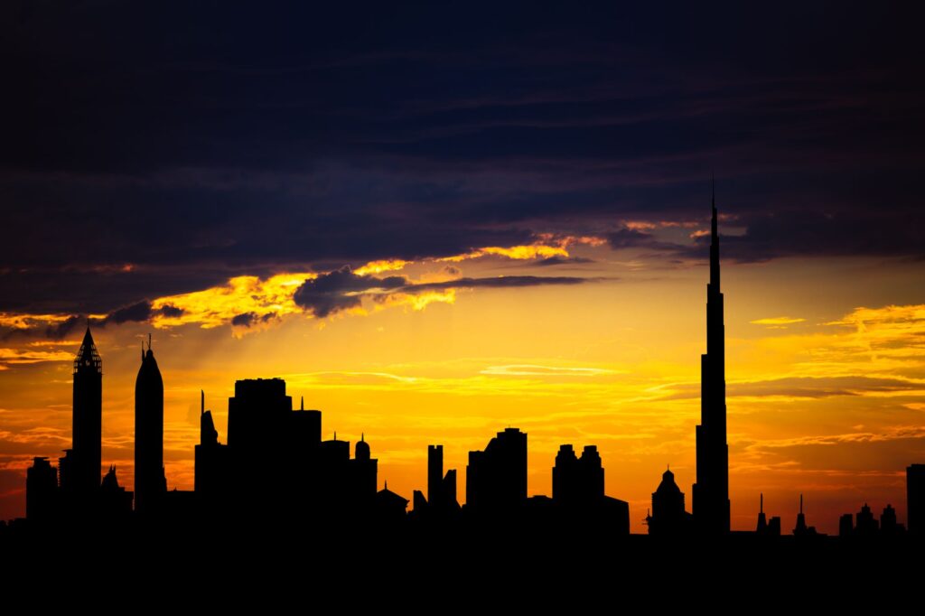 Dubai skyline with skyscrapers including the Burj Khalifa at sunset