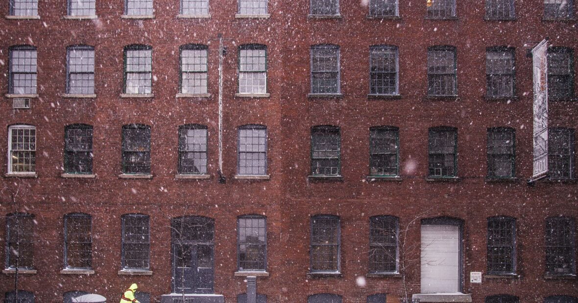 Kansas City area under winter weather advisory with snowy roads and skyline