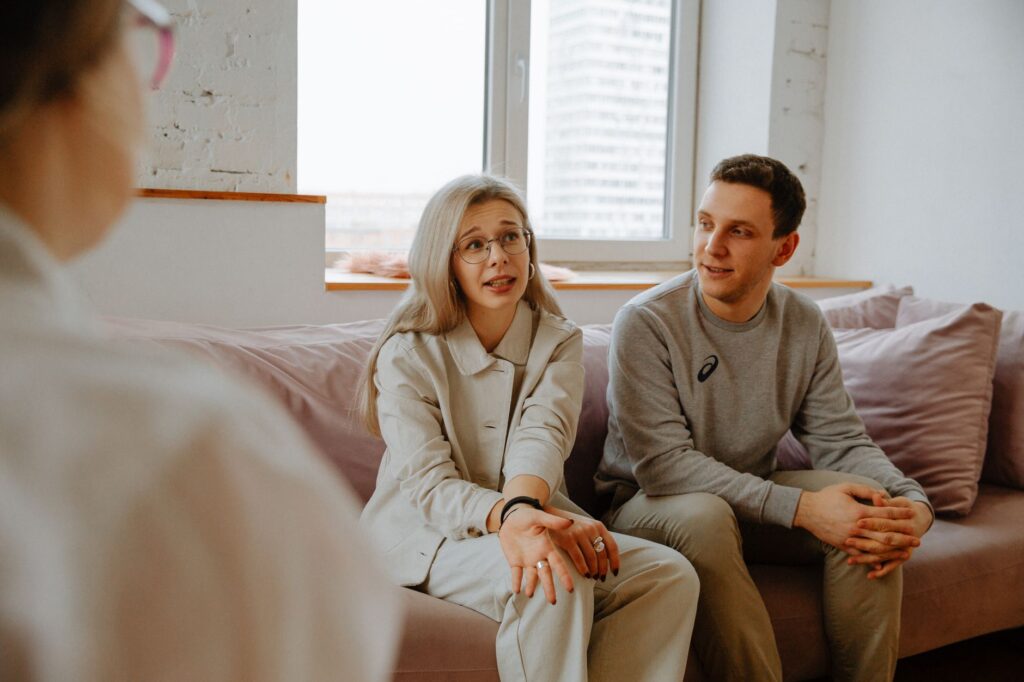 two people in counseling session representing support for high divorce rate communities