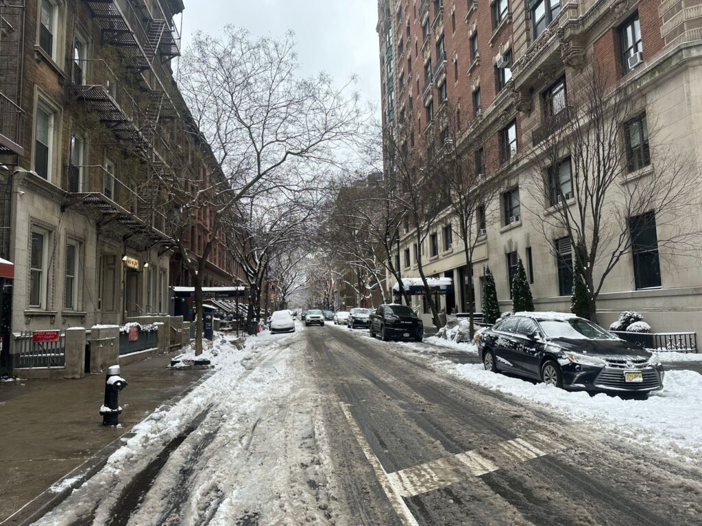 pedestrians walking safely through a busy Manhattan neighborhood near Union Square