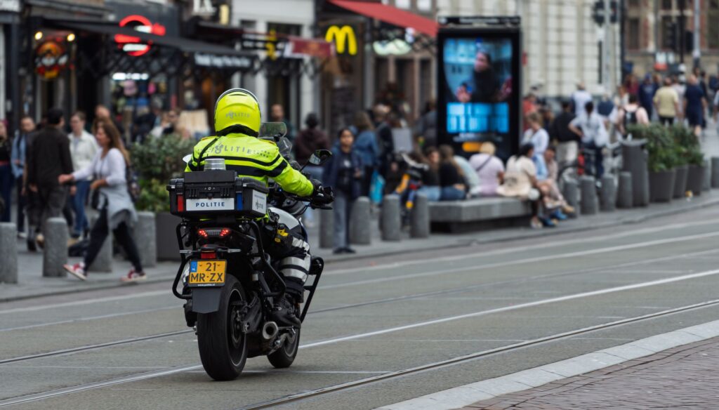 transit police officers patrolling subway station platform for public safety
