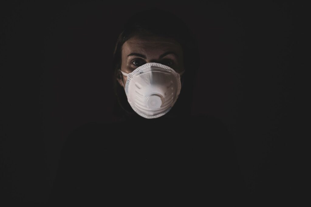 person wearing an N95 respirator mask in a healthcare facility