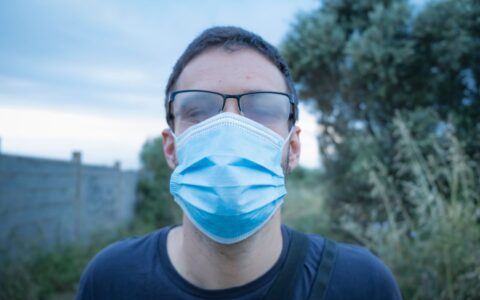 person wearing a covid face mask in a public setting