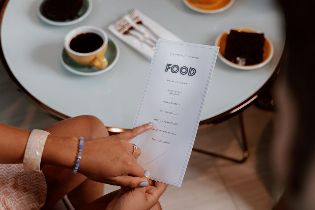 diner reviewing menu for hidden restaurant charges New York