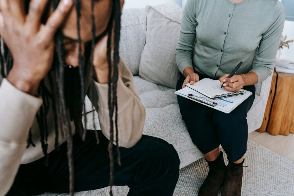 domestic violence counselor speaking with a survivor in Indiana support center