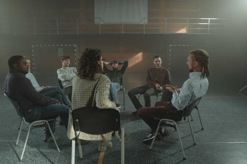 people sitting in a community support circle representing mental health resources in New Jersey