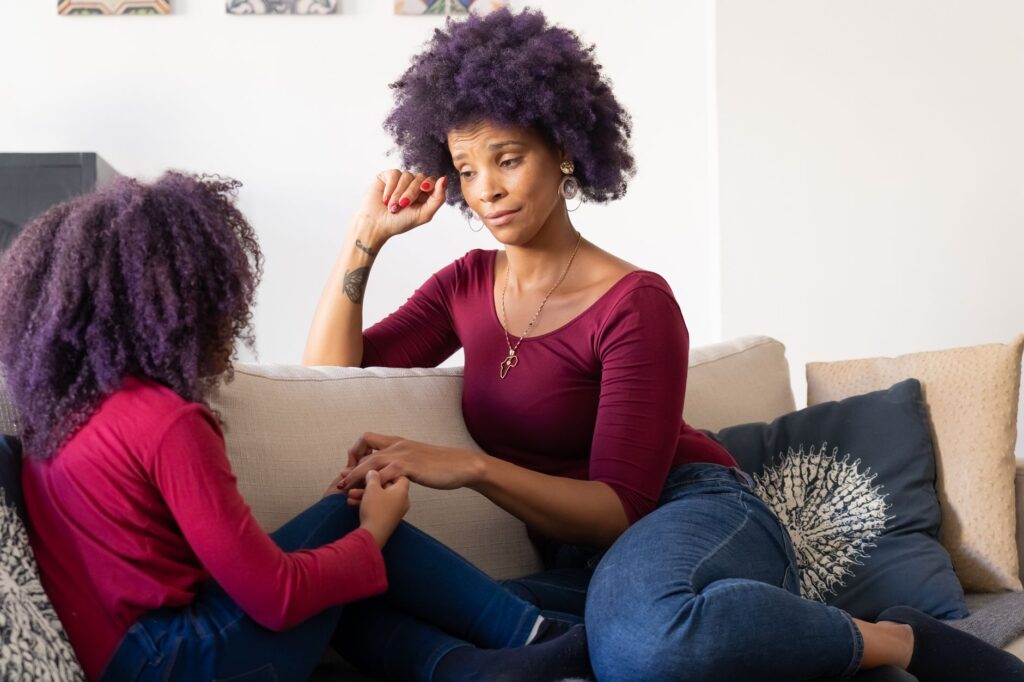 a parent talking to a young child about safety at home, relevant to preventing school firearm incidents