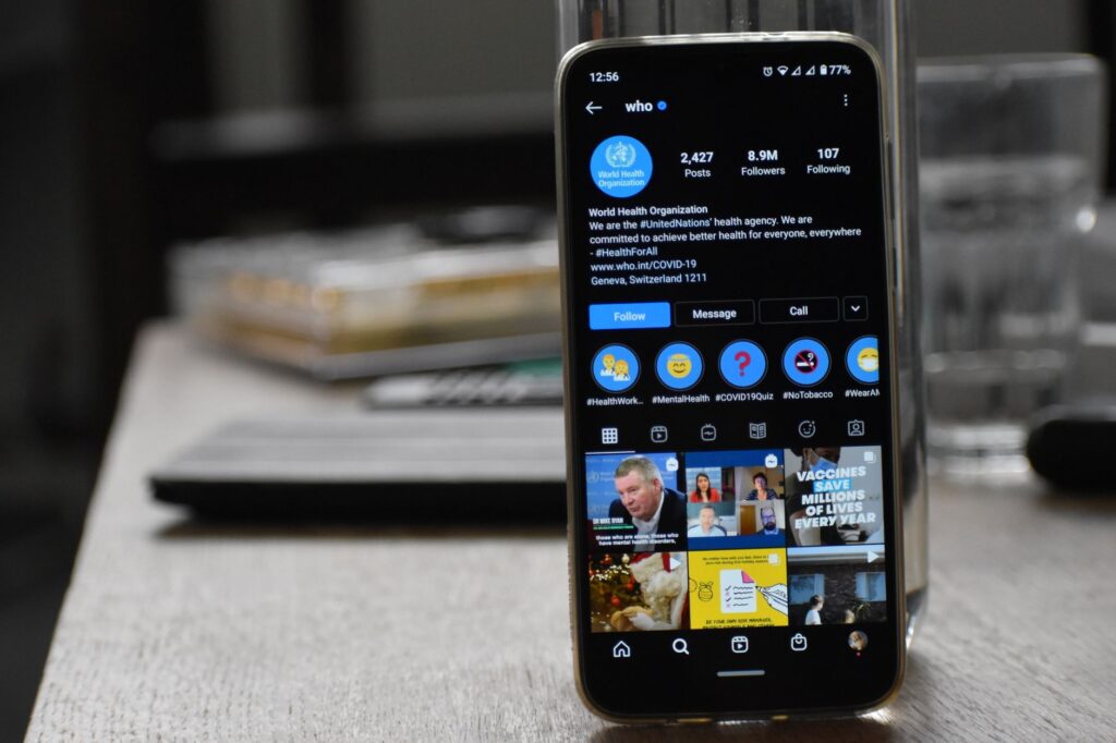 person scrolling phone reacting to Eminem death announcement internet frenzy