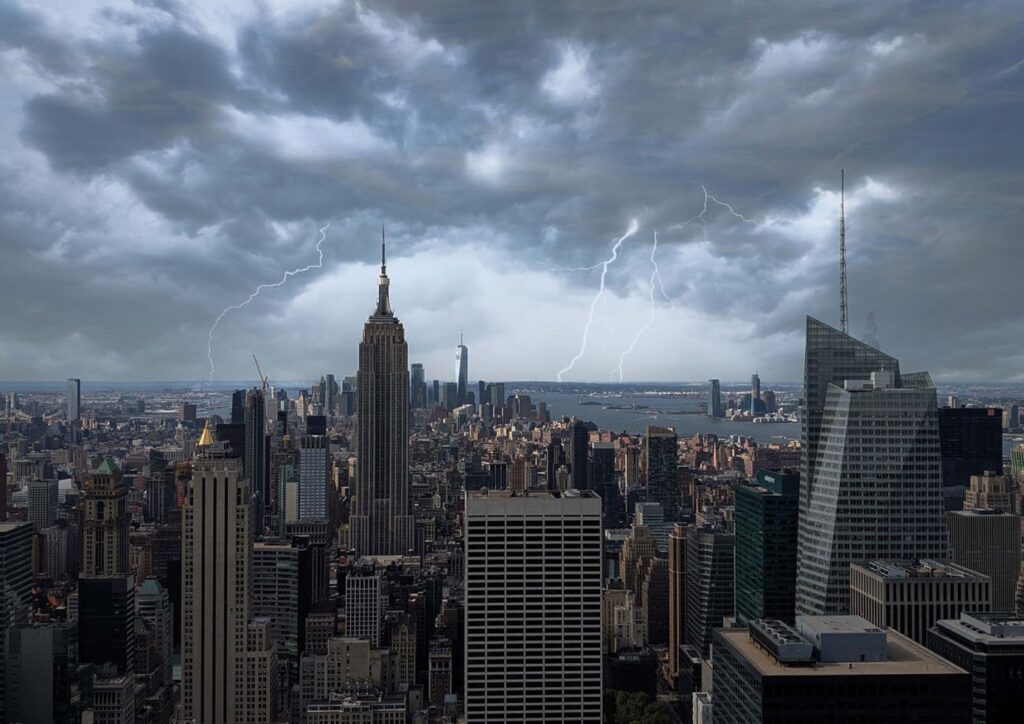 New York City residents cleaning up after a major storm with downed branches
