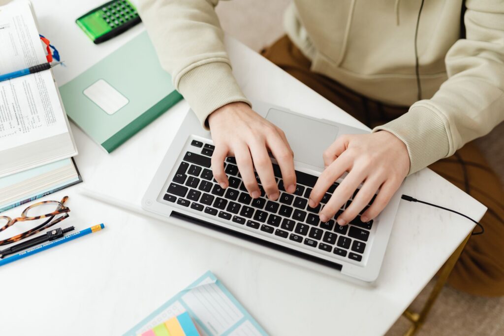 a traveler researching safety in American cities on a laptop