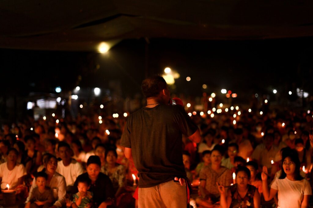 community members holding candles at a vigil for a teen shooting victim in Washington D.C.