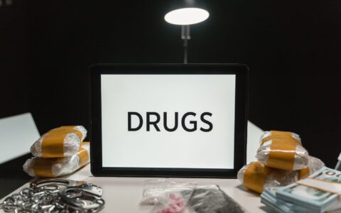 law enforcement officers conducting a hotel drug and weapon bust in Maryland