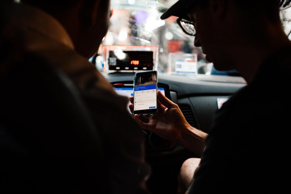 driver using smartphone app to find lowest gas prices in Georgia