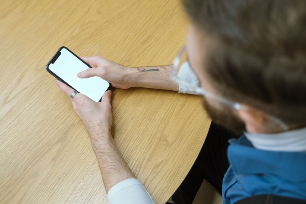 American checking stimulus check news on smartphone