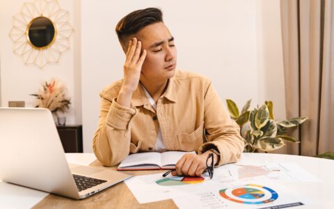 person overwhelmed by personal loan repayment consequences