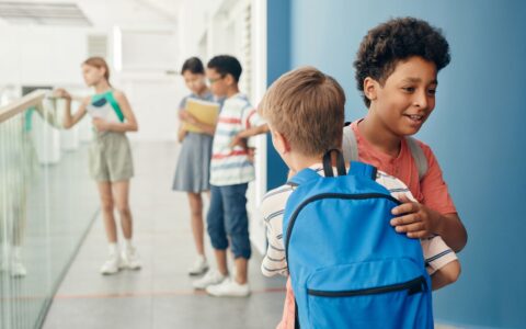 a backpack in an elementary school hallway representing the Brownsburg gun incident