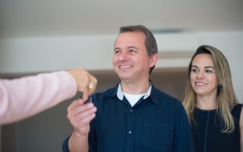 homeowner reviewing stimulus check update for $1,400 state rebate program
