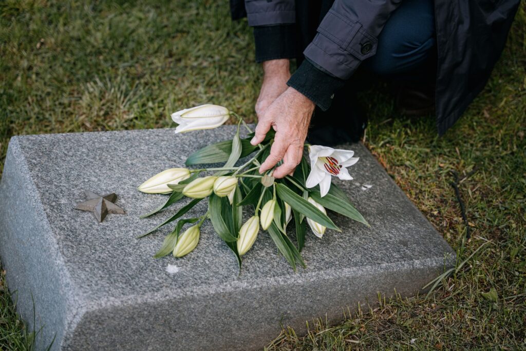 roadside memorial flowers for NYPD officer killed in Southern State Parkway crash