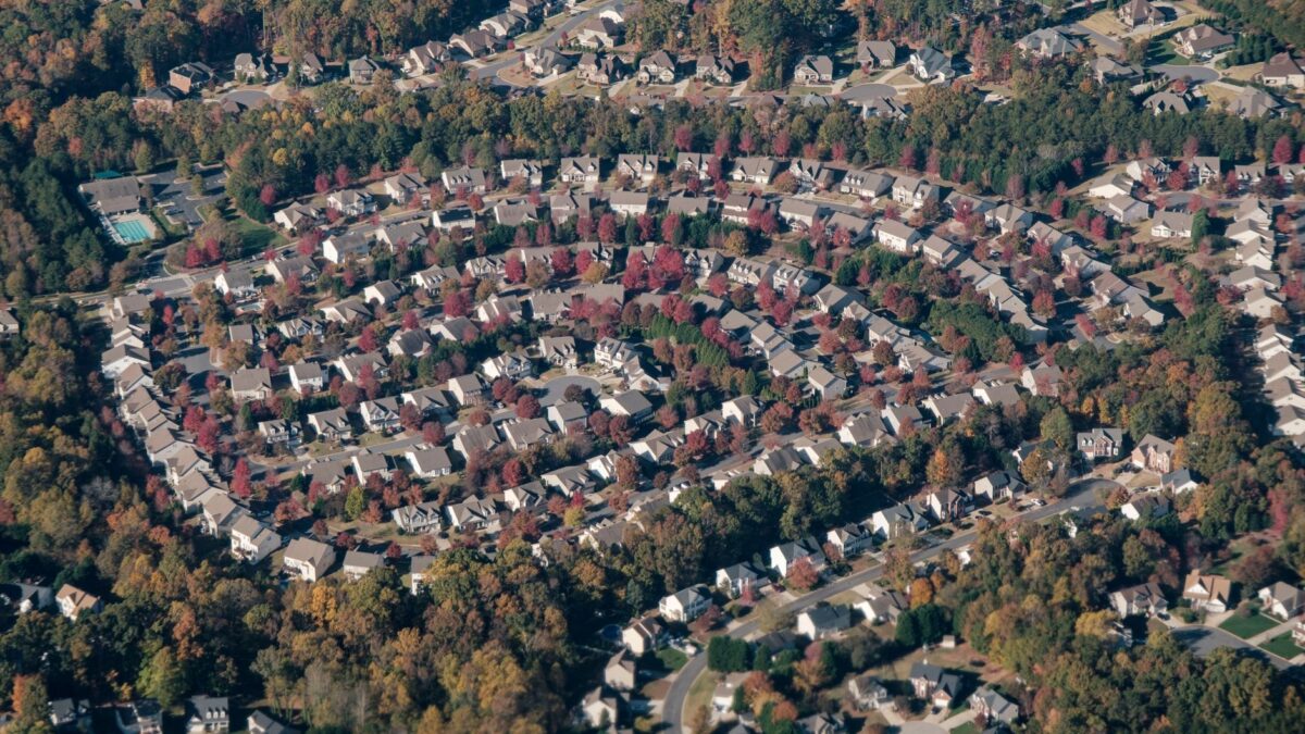 Row of suburban houses representing the states with the highest property taxes in 2026