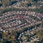 Row of suburban houses representing the states with the highest property taxes in 2026
