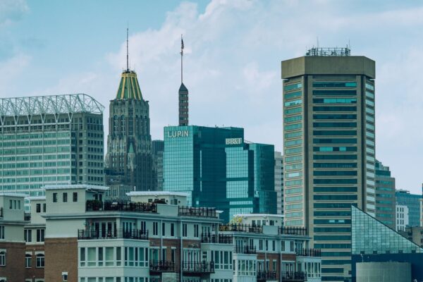 Baltimore Inner Harbor skyline with downtown towers, featured image for the 2026 neighborhoods guide