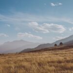 Colorado town with mountains under a hot summer sky