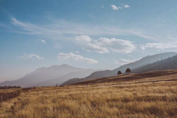 Colorado town with mountains under a hot summer sky