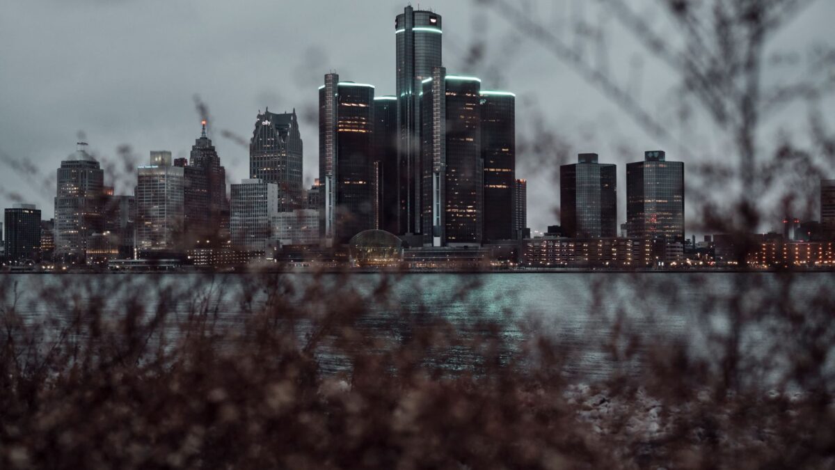Detroit skyline at dusk with downtown towers along the Detroit River