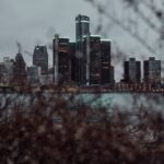 Detroit skyline at dusk with downtown towers along the Detroit River