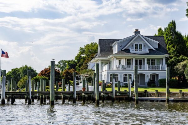 Waterfront home with a dock on a sunny summer day