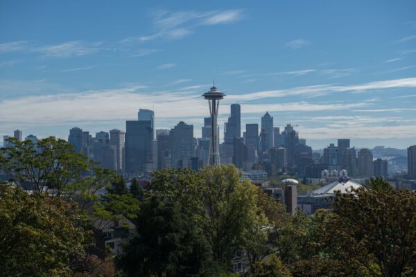 Seattle skyline at sunset with the Space Needle rising above the downtown towers