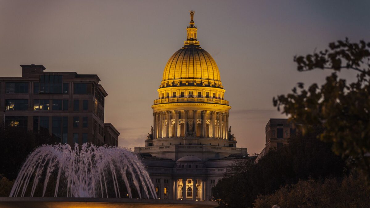 Madison Wisconsin skyline with the State Capitol dome overlooking Lake Monona at sunset
