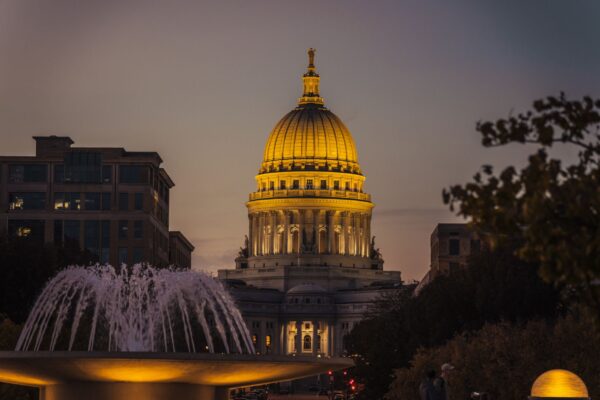 Madison Wisconsin skyline with the State Capitol dome overlooking Lake Monona at sunset