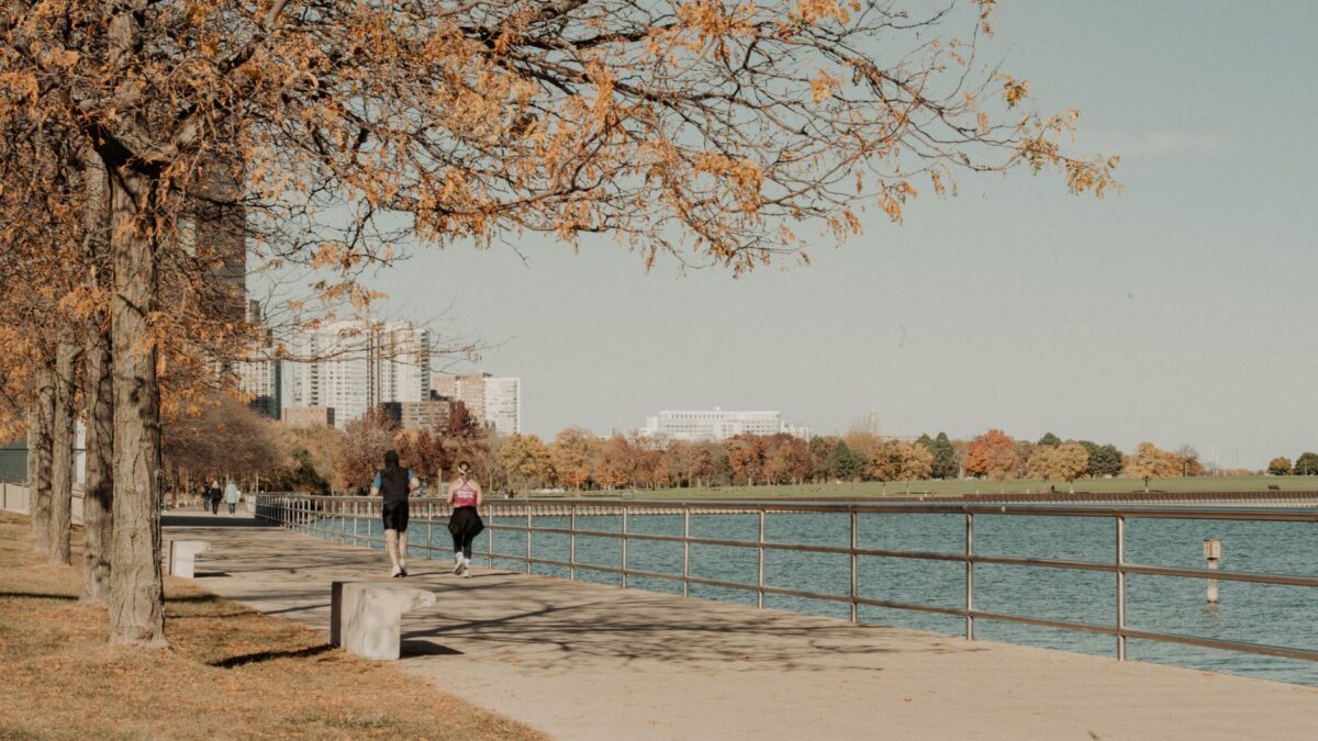 Joggers on the Lake Michigan lakefront path near downtown Milwaukee in autumn