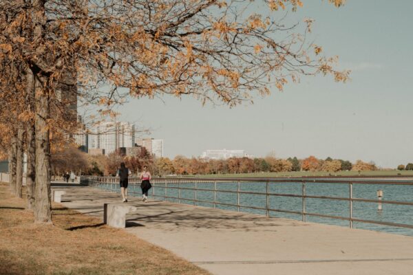 Joggers on the Lake Michigan lakefront path near downtown Milwaukee in autumn