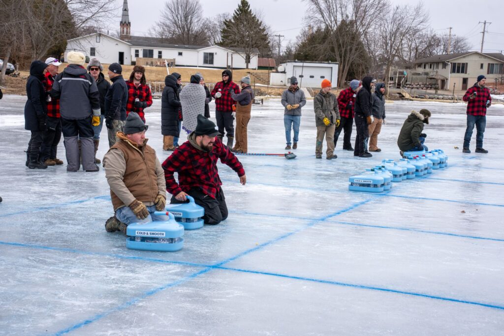 people socializing indoors during Minnesota winter at a community gathering