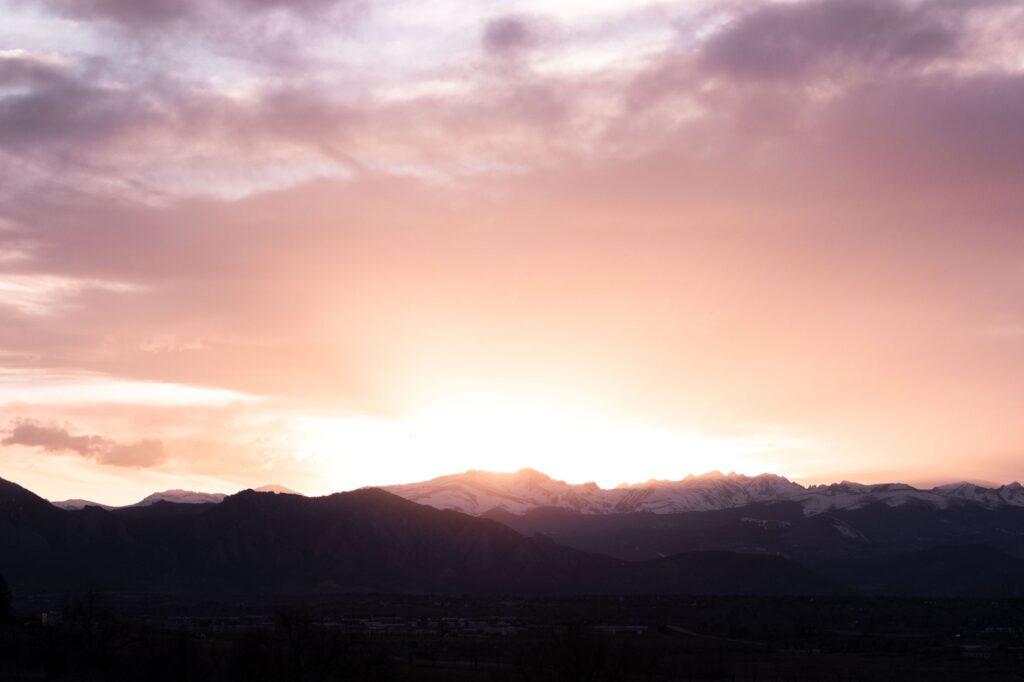 Colorado city skyline with mountain backdrop representing safety and community