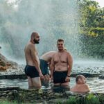 Visitors soaking in a natural hot spring pool